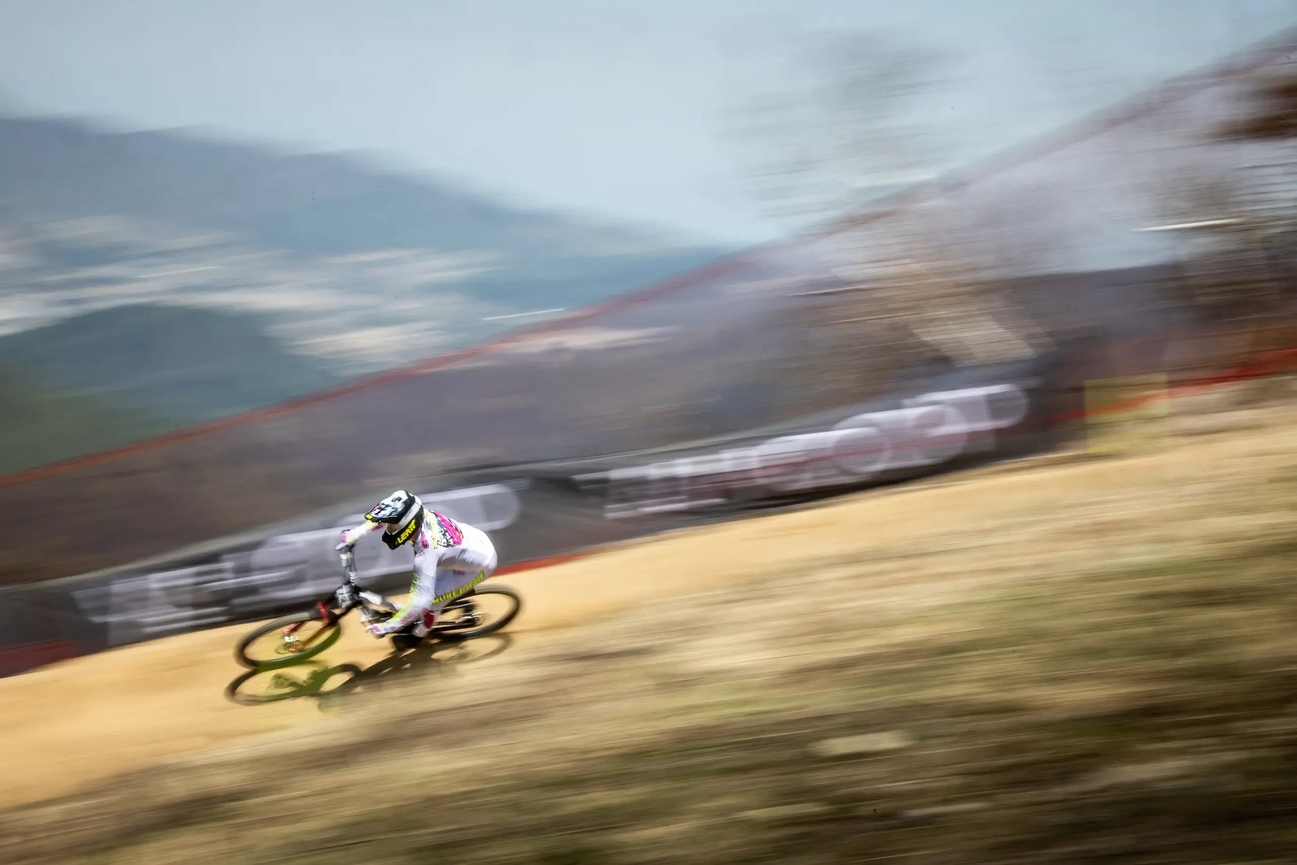 Biker in action on a mountain trail with blurred motion