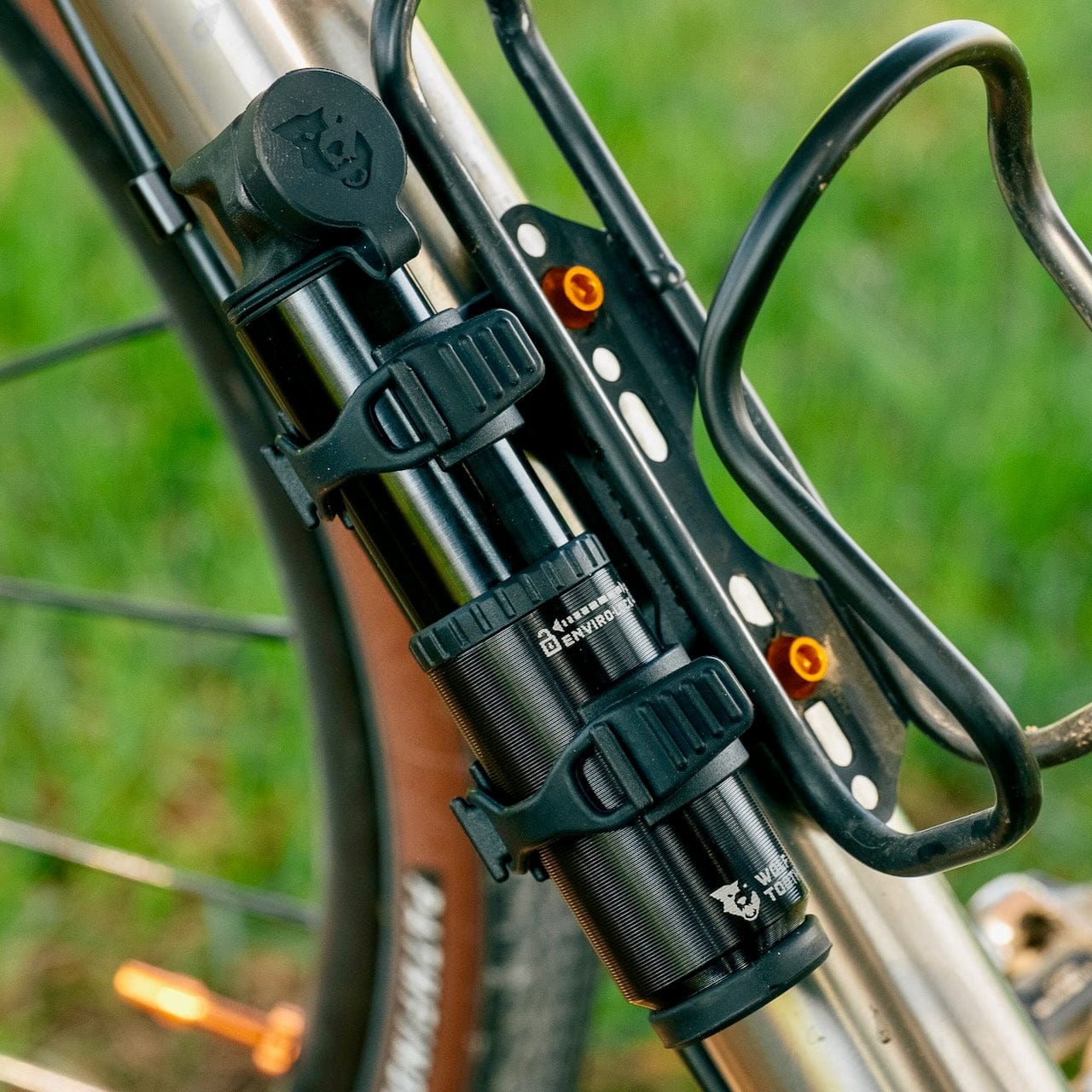 EnCase Pump 40cc mounted to a titanium-tubed gravel bike with standard pump mount.