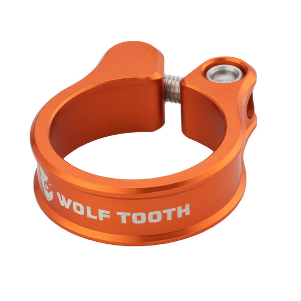 Wolf Tooth Seat Post Clamps, shown in orange, are precision-engineered to secure your seatpost.