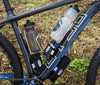 Wolf Tooth B-RAD bases used to mount multiple bottle cages, bags, and multitools on a mountain bike.
