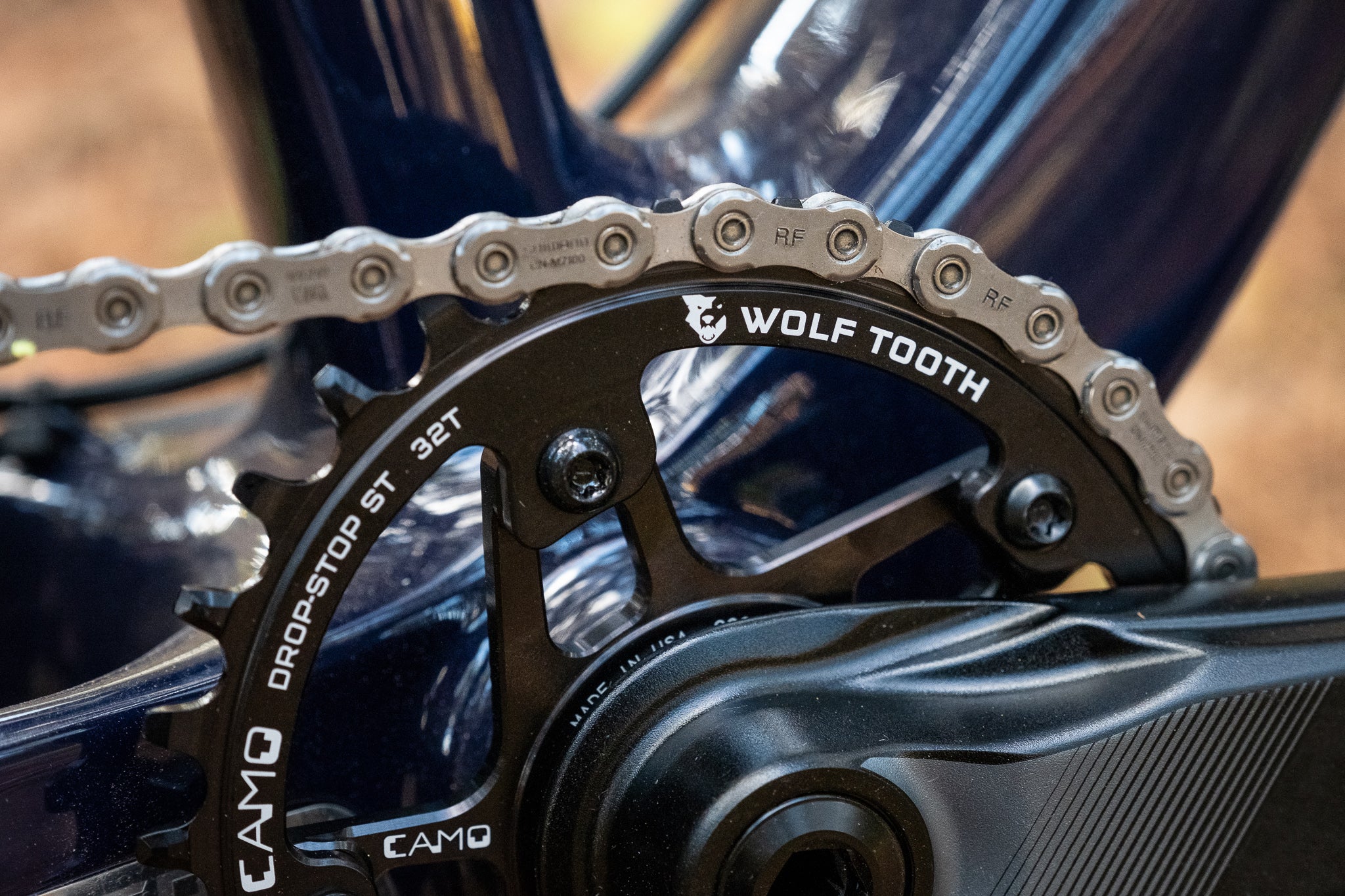 Close up view of a Wolf Tooth CAMO Drop-Stop ST 32T chainring installed on a mountain bike.