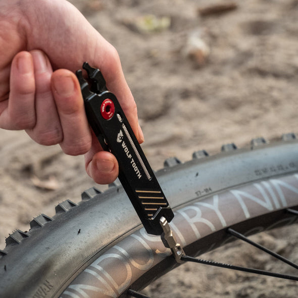 Wolf Tooth 8-Bit Pack Pliers used to tighten spoke nipple