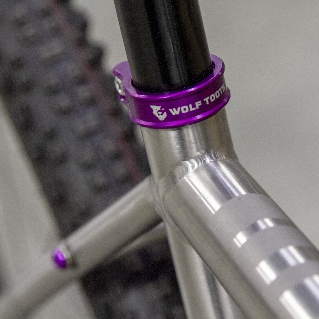 https://www.wolftoothcomponents.com/cdn/shop/products/SeatClamp_Warakin_Purple_01.jpg?v=1702083778