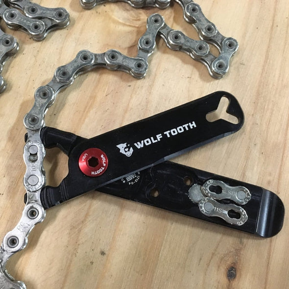 Wolf Tooth Pack Pliers, Master Link Combo Pliers, Black with Red Bolt, showing how to remove a bicycle chain master link