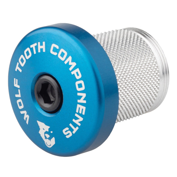 Wolf Tooth compression plug with integrated 5mm spacer blue anodized stem cap.