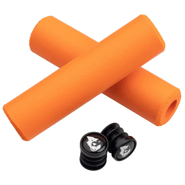 Wolf Tooth Fat Paw handlebar grips in orange with bar end plugs