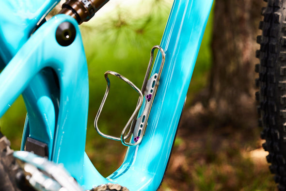 Adjustable water bottle cage for bike. Wolf Tooth Morse Cage stainless steel