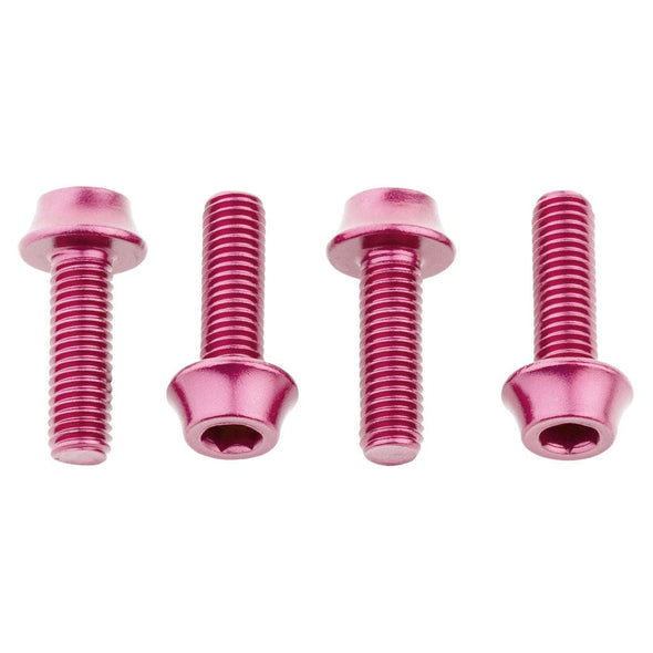 Four pink anodized aluminum alloy water bottle cage bolts in a row