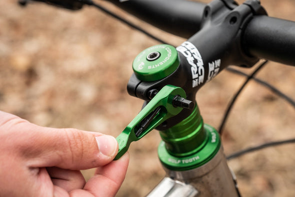 Wolf Tooth Axle Handle Multi-tool removes axle and stores bits for trailside repairs. 